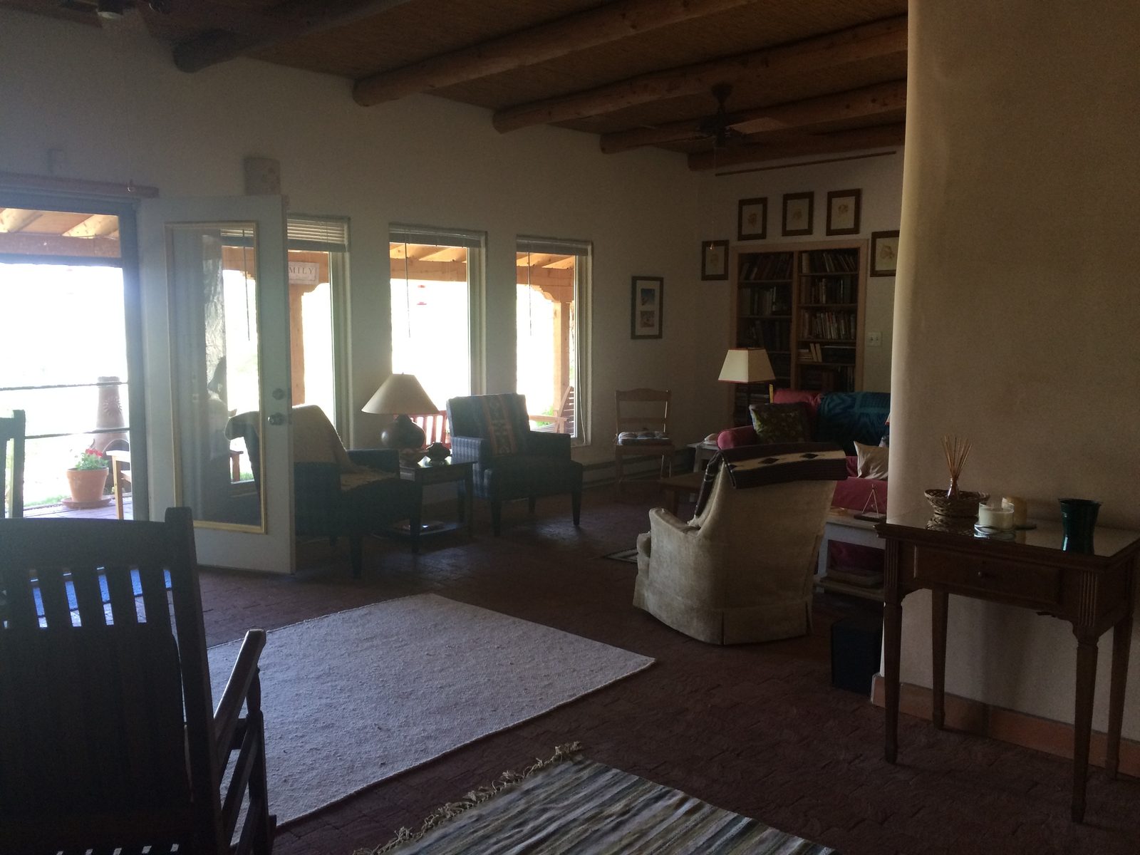 The living room, with viga ceiling and doors onto the portal